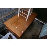 A 1980s oblong coffee table and a child's rust seated chair