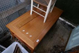 A 1980s oblong coffee table and a child's rust seated chair