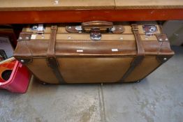 A good quality leather and canvas suitcase