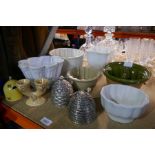 A selection of honey pots and ceramic jelly moulds