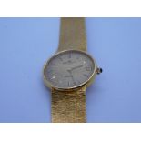 Baume & Mercier; a vintage gents Baume & Mercier BM 12820 automatic wristwatch, with gold dial, bato
