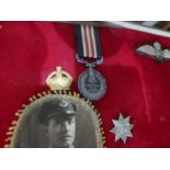 Of Military interest; a George V World War I medal for Bravery in the Field, military badges and eph