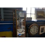 An early 20th century mahogany draught screen having glazed panels and gilt pier mirror, with twist