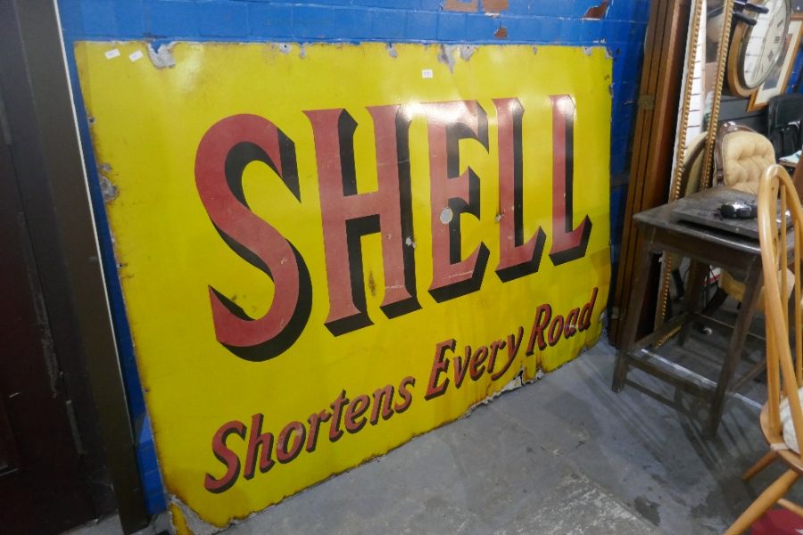 A mid century large enamel sign for Shell "Shortens Every Road" Oil company, 183 cm x 122 cms, singl