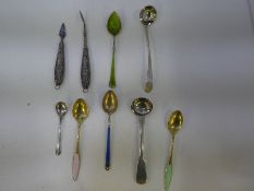 A quantity of silver spoons to include decorative enamel spoons, some foreign examples some gilt wit
