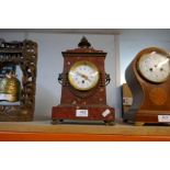 A circa 1900 French red marble mantel clock having gilt metal mounts