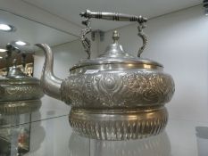 A large metal coffee pot, approximately 34cm diameter body. An ornate coffee bean design and floreat