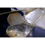 A silver Vodka decanter label by a Marston and Co, a Prince Charles and Lady Diana silver spoon, a P