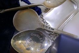 A silver Vodka decanter label by a Marston and Co, a Prince Charles and Lady Diana silver spoon, a P