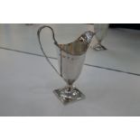 A Samuel Menton II Silver George III creamer with beaded rim and on a square base. Hallmarked London
