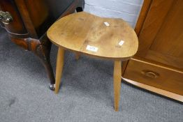 A small Ercol stool having shaped top