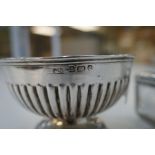 A half reeded silver bon bon dish on a circular pedestal foot hallmarked Birmingham 1904 William Dev