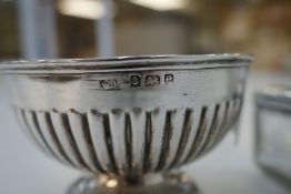 A half reeded silver bon bon dish on a circular pedestal foot hallmarked Birmingham 1904 William Dev
