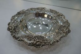 A sterling silver fruit bowl having a very decorative design of pierced pattern and embossed floreat