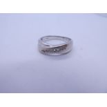 18ct white gold crossover design ring chanel set with 7 small brilliant cut diamonds, approx. 0.25 c