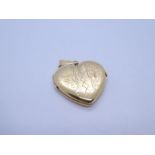 18ct yellow gold heart shaped locket, the front engraved floral decoration 2.5cm, marked 750, approx