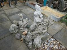 A stone effect garden gnome and a selection of animals and frogs