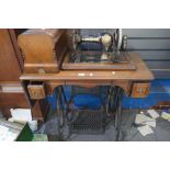 An antique sewing machine by Jones on treadle base