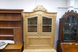 An old French stripped pine bureau book case, having 3 long drawers to the base, 101cm