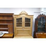 An old French stripped pine bureau book case, having 3 long drawers to the base, 101cm