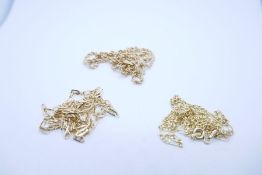 Three 9ct yellow gold neckchains to include a ropetwist necklace, figaro design and another, all mar