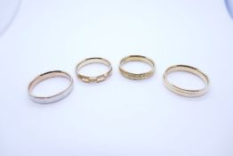 Four 9ct gold hollow wedding bands all with various patterns, approx 6.6g all marked, various sizes