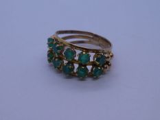14ct yellow gold dress ring set two rows of green stones, marked 14 size P, approx 3.5g