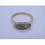 18ct yellow gold dress ring with oval panel set with two large old cut diamonds and 4 smaller diamon