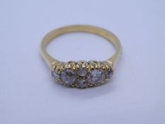 18ct yellow gold dress ring with oval panel set with two large old cut diamonds and 4 smaller diamon