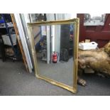 A large modern gilt framed wall mirror