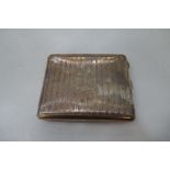 A silver striped pattern cigarette case having central cartouche initialled and gilted interior. Hal