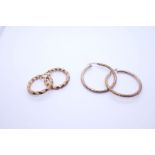 Two pairs of 9ct yellow gold hoop earrings, one pair of twisted design, both marked 375, the largest