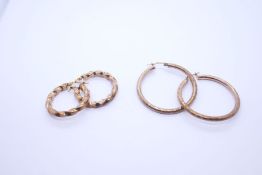 Two pairs of 9ct yellow gold hoop earrings, one pair of twisted design, both marked 375, the largest