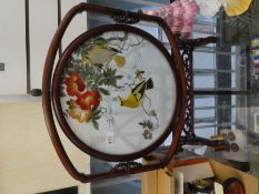 A modern Chinese hardwood screen decorated birds and foliage
