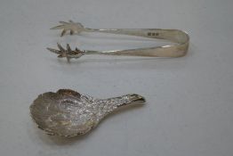 Eagle's wing a modern silver caddy spoon having highly decorative embossed body showing detailed ful