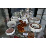 A shelf of Poole pottery and sundry items