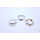 Three 9ct gold rings to include white and yellow gold wedding bands, all marked 9K