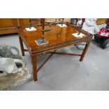 A reproduction mahogany coffee table having pierced gallery