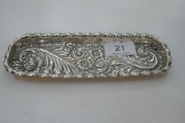 A heavily decorative Victorian silver American long trinket tray. Foiate scrolls and floral detailin