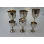 A quantity of silver trophy cups of various styles and hallmarks. One gilted interior. Weight approx