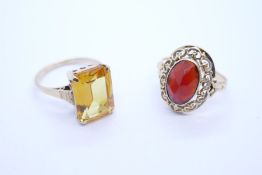 9ct yellow gold dress ring with scissor cut citrine, marked 375 size O/P, and a yellow gold dress ri