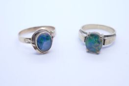 Two 9ct yellow gold dress rings each set with an oval opal, both marked 9ct, sizes N & R, approx 6g