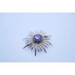 Vintage yellow gold brooch of Starburst form with large central round cut amethyst, with twisted fra