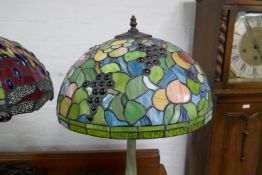 A modern Tiffany style table lamp, the shade decorated fruit