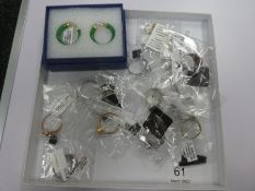 Tray of as new silver dress rings incl. Swarovski set, tanzanite, red jade. opal etc and two pairs o