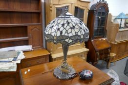 A modern Tiffany style table lamp having cream shade decorated dragonflies