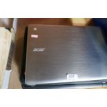 Three laptops including an Acer laptop