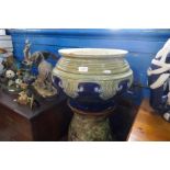 A large Royal Doulton glazed stoneware jardinière and a Royal Doulton plant stand both A/F