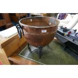 An old copper log bin having iron handles & feet - diameter approx 38cm and handles, height 39cm