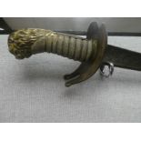 A sword having curved blade with lion head handle and Shagreen grip, the engraved blade having initi